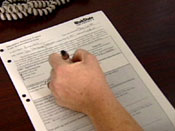 Individual filling out a form
